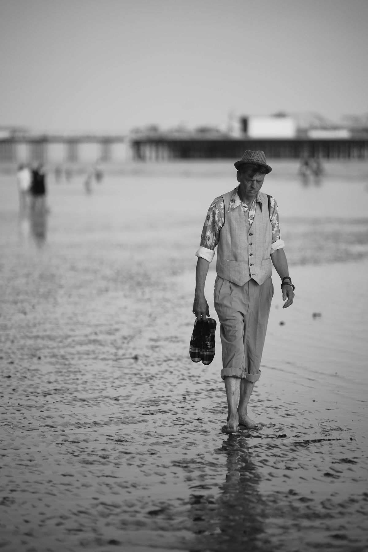 A nicely attired chap ready for a paddle on Brighton beach.