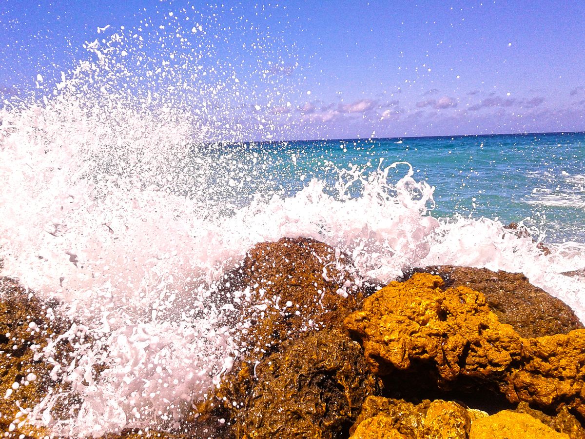 Waves crashing upon a rocky shoreline, Gozo